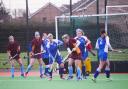 BATTLE: Tracey Dunn (centre, in blue) was joint player of the match for Burnham against ECVH. Pic: Steve Richardson