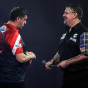 CONTROVERSY: Mensur Suljovic (left) and Gary Anderson in action at the World Darts Championship at Alexandra Palace (pic: Kieran Cleeves/PA Wire)