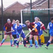 BATTLE: Tracey Dunn (centre, in blue) was joint player of the match for Burnham against ECVH. Pic: Steve Richardson