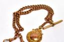 9ct rose gold double Albert chain hammer went for £850. Picture: GTH