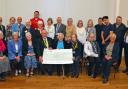 The cheques were presented on March 28 at the Berrow Village Hall
