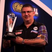 REMATCH: Gary Anderson with his runners-up trophy after losing the final against Gerwyn Price at the William Hill World Darts Championship, at Alexandra Palace, in January (pic: PA)