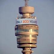 The BT tower displaying the RNLI's 200th anniversary banner.