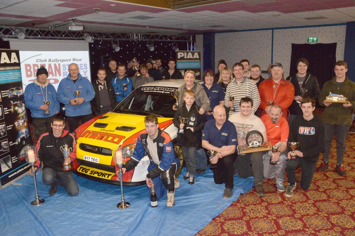 SUCCESS: Rally winner, Arron Newbay and Ian Davis, front, celebrate their success with all the rally competitors. Credit: Mike Lang