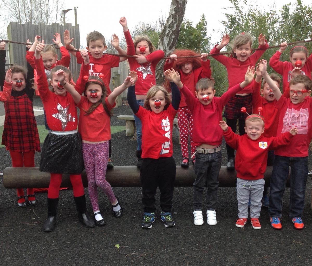 CHEERING: Pupils from Mark School celebrate Red Nose Day