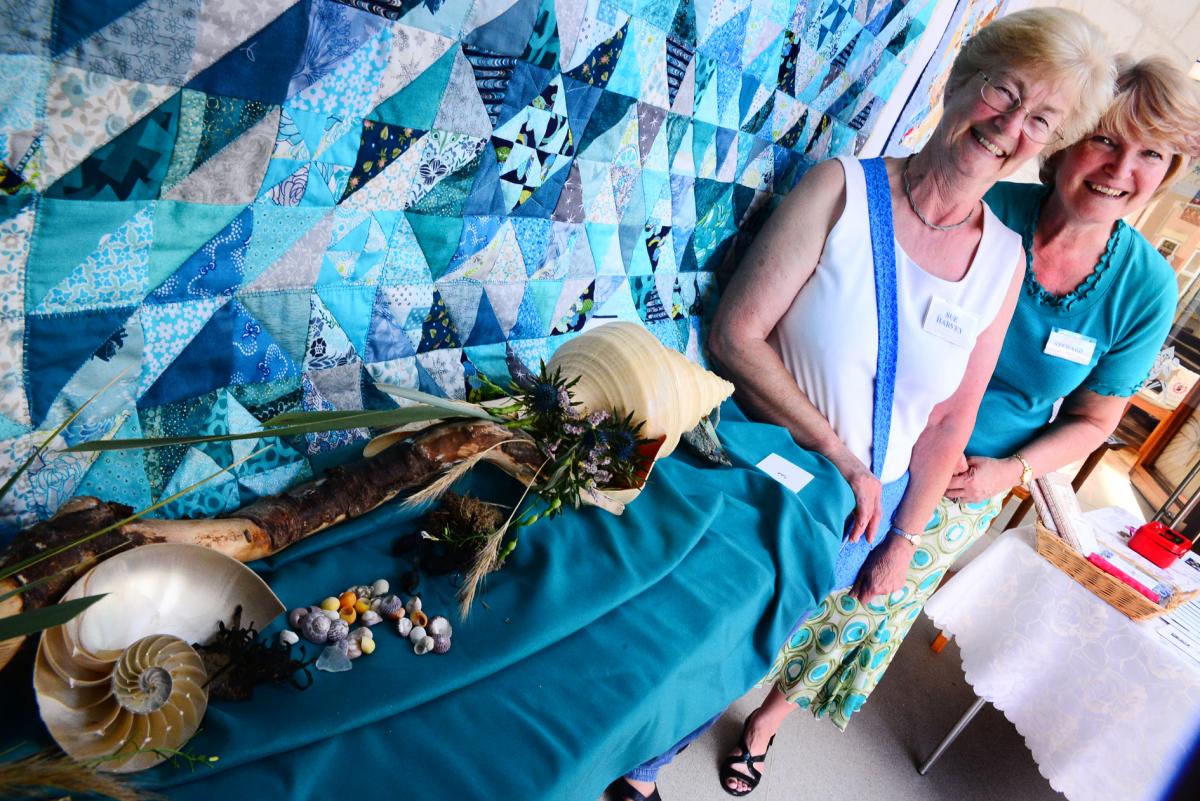 PROUD: ; Sue Harvey and Jane Wotherspoon with their colourful quilt