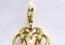 Gold ruby and seed pearl pendant hammer