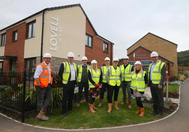 Lovell and Abri team members celebrating the first affordable homes handover at Foxglove Meadows