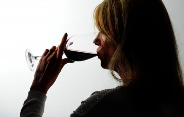 Burnham and Highbridge Weekly News: A woman drinking red wine. Credit: PA
