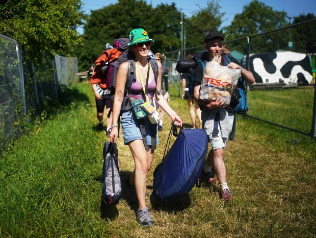Burnham and Highbridge Weekly News: People arrive on the first day of the Glastonbury Festival at Worthy Farm in Somerset (PA/PA Wire. Photo by Yui Mok