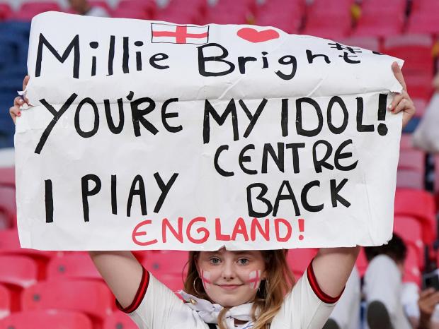 Burnham and Highbridge Weekly News: An England fan holds a "Millie Bright You're My Idol" sign in the stands as England celebrate winning the UEFA Women's Euro 2022 final at Wembley Stadium, London. Picture date: Sunday July 31, 2022.