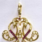Gold ruby and seed pearl pendant hammer
