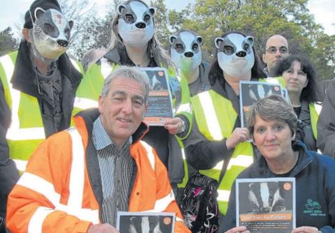 Adrian Coward, chairman of the Somerset Badger Group, and Pauline Kidner, founder of Secret World, with protesters at the Badger Night Walk in Dunster